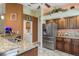 Well-equipped kitchen with stainless steel appliances, granite countertops, and stylish cabinetry at 1312 Gulf Rd, Tarpon Springs, FL 34689