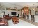 Living area with a large TV, kitchen bar, and comfortable seating at 1312 Gulf Rd, Tarpon Springs, FL 34689