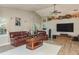 Inviting living room with vaulted ceilings, laminate floors, and a plush leather sofa set at 1312 Gulf Rd, Tarpon Springs, FL 34689