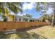 Charming backyard with a wooden fence and lush greenery at 1431 54Th Ne Ave, St Petersburg, FL 33703