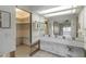Bathroom featuring vanity with cabinets and a large mirror at 1431 54Th Ne Ave, St Petersburg, FL 33703