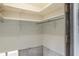 A walk-in closet with basic shelving for optimal storage at 1431 54Th Ne Ave, St Petersburg, FL 33703