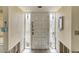 Front door entrance featuring a white door with sidelights and tiled flooring at 1431 54Th Ne Ave, St Petersburg, FL 33703