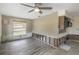 Bright living room featuring ceiling fan and wood flooring at 1431 54Th Ne Ave, St Petersburg, FL 33703