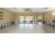Open-concept living room featuring large sliding glass doors leading to outdoor patio with furniture at 1431 54Th Ne Ave, St Petersburg, FL 33703