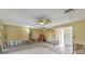 Spacious living room featuring ceiling fans, tiled flooring, and lots of natural light at 1431 54Th Ne Ave, St Petersburg, FL 33703