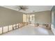 Open-concept living room with ceiling fan and view into the bathroom at 1431 54Th Ne Ave, St Petersburg, FL 33703