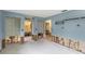 Spacious living room with multiple doorways and natural light from the windows at 1431 54Th Ne Ave, St Petersburg, FL 33703