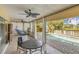 Relaxing sunroom patio leads to a sparkling pool and lush backyard at 1431 54Th Ne Ave, St Petersburg, FL 33703