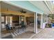 Cozy patio with furniture and a view of the sunroom and backyard at 1431 54Th Ne Ave, St Petersburg, FL 33703