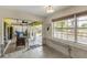Sunroom overlooking pool and backyard with outdoor seating at 1431 54Th Ne Ave, St Petersburg, FL 33703