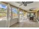 Bright sunroom with multiple windows offers views of the pool and backyard at 1431 54Th Ne Ave, St Petersburg, FL 33703