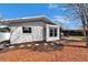 Exterior view showcases a well-maintained home with a manicured landscape and tiled roof at 14490 Passage Way, Seminole, FL 33776