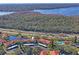 Beautiful aerial view of buildings near the lake, highway and swimming pool at 1801 E Lake Rd # 9G, Palm Harbor, FL 34685