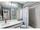 Well-maintained bathroom with a tiled shower and a modern vanity, offering a clean and fresh look at 1801 E Lake Rd # 9G, Palm Harbor, FL 34685