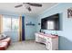 Bright bedroom featuring a large window, neutral carpet, and plenty of natural light at 1801 E Lake Rd # 9G, Palm Harbor, FL 34685