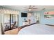 Cozy bedroom featuring a private balcony and ensuite bathroom at 1801 E Lake Rd # 9G, Palm Harbor, FL 34685