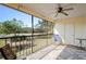 Relaxing screened lanai offering scenic views of lush landscaping and a tranquil pond at 1801 E Lake Rd # 9G, Palm Harbor, FL 34685