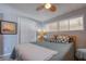 Bedroom featuring a comfortable bed, ceiling fan, closet, and natural light at 18675 Us Highway 19 N # 267, Clearwater, FL 33764