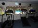 Well-equipped gym overlooking the pool, offering treadmills and ellipticals for a complete workout at 2623 Seville Blvd # 111, Clearwater, FL 33764
