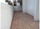 Private patio space with brick pavers, perfect for outdoor seating or relaxation in a tranquil setting at 2623 Seville Blvd # 111, Clearwater, FL 33764