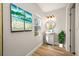 Bright bathroom with modern vanity, round mirror, and decorative artwork at 2829 9Th W Ave, Bradenton, FL 34205