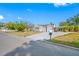 Exterior of well kept home shows attached garage, new driveway, and flagpole at 2829 9Th W Ave, Bradenton, FL 34205