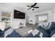 Comfortable living room with plush blue sofa, large TV, and view to the backyard at 2829 9Th W Ave, Bradenton, FL 34205