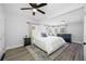 Main bedroom featuring neutral decor, ceiling fan, and a wall of windows at 2829 9Th W Ave, Bradenton, FL 34205