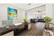 Contemporary office space with a view into a living room featuring a large sectional sofa and bright natural light at 2829 9Th W Ave, Bradenton, FL 34205