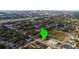 Aerial view of the neighborhood and surrounding landscape with the city in the background at 2912 N 29Th St, Tampa, FL 33605