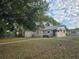 Fenced backyard featuring a small shed and a view of the home's exterior at 2912 N 29Th St, Tampa, FL 33605