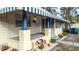 Inviting front porch with awning, painted columns, and landscaped garden at 2912 N 29Th St, Tampa, FL 33605