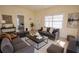 Well-decorated living room with gray sofa, ottomans, and modern decor at 2912 N 29Th St, Tampa, FL 33605