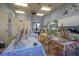 Spacious activity room with painting supplies, tables and art on the walls at 304 Silver Falls Dr, Apollo Beach, FL 33572