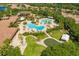 Aerial view features resort style pools, putting green, and lush landscaping at 304 Silver Falls Dr, Apollo Beach, FL 33572