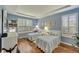 Guest bedroom features two twin beds, hardwood floors and plantation shutters at 304 Silver Falls Dr, Apollo Beach, FL 33572
