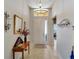 Welcoming entryway with neutral tones, decorative lighting, and tiled flooring at 304 Silver Falls Dr, Apollo Beach, FL 33572