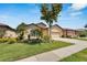 Charming single-story home featuring a well-manicured lawn and a two-car garage at 304 Silver Falls Dr, Apollo Beach, FL 33572