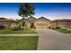 Charming single-Gathering home with a well-manicured lawn, two car garage and inviting curb appeal at 304 Silver Falls Dr, Apollo Beach, FL 33572