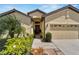 Charming single-story home featuring a well-manicured lawn and a two-car garage at 304 Silver Falls Dr, Apollo Beach, FL 33572
