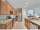 Spacious kitchen with granite countertops, stainless steel appliances, and ample cabinet space at 304 Silver Falls Dr, Apollo Beach, FL 33572