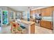 Bright kitchen with granite counters, stainless steel appliances and breakfast bar seating at 304 Silver Falls Dr, Apollo Beach, FL 33572