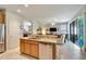 Open kitchen island with granite countertops, a stainless steel dishwasher, and an open floor plan at 304 Silver Falls Dr, Apollo Beach, FL 33572