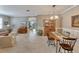 Spacious living room with tile floors, crown moulding and an open floor plan at 304 Silver Falls Dr, Apollo Beach, FL 33572
