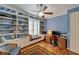 Home office features built-in bookshelves, desk and lots of natural light at 304 Silver Falls Dr, Apollo Beach, FL 33572