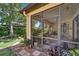 A screened-in patio showcases easy access to the home's lush, well-maintained backyard at 304 Silver Falls Dr, Apollo Beach, FL 33572