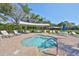 Relax at the community pool, featuring a whirlpool spa, lounge chairs, and outdoor dining area at 304 Silver Falls Dr, Apollo Beach, FL 33572