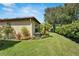 Lush green lawn with mature trees and landscaping creates a private backyard at 304 Silver Falls Dr, Apollo Beach, FL 33572