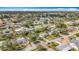 High-angle aerial shot showcasing a vibrant suburban community with a mix of housing, mature trees, and roadways at 3124 61St N Ln, St Petersburg, FL 33710